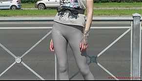 Sexy Natalia walks down the street in tight leggings